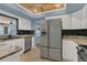 Kitchen features granite counters, stainless appliances, and tiled floors at 334 Terrace Dr, Oviedo, FL 32765