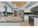 Kitchen features granite counters, stainless appliances, and tiled floors at 334 Terrace Dr, Oviedo, FL 32765