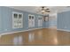 The living room has hardwood floors, large windows with natural light, and an open feel at 334 Terrace Dr, Oviedo, FL 32765
