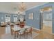 The living room and dining area offers hardwood floors, natural light, and updated kitchen at 334 Terrace Dr, Oviedo, FL 32765