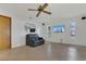 Bright living room features tile floors, a sofa, and large windows at 334 Terrace Dr, Oviedo, FL 32765