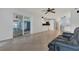 Bright and airy living room with tile floors and views into kitchen and dining area at 334 Terrace Dr, Oviedo, FL 32765