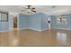 Open floor plan with hardwood floors, an open feel, and view to kitchen at 334 Terrace Dr, Oviedo, FL 32765