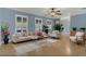 Inviting living room with neutral furniture, hardwood floors, and large windows at 334 Terrace Dr, Oviedo, FL 32765