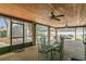 Relax on this covered and screened patio, perfect for outdoor dining with views of the pool and yard at 334 Terrace Dr, Oviedo, FL 32765