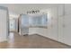 Stylish wet bar with light blue walls, white cabinets, granite countertops, and tile flooring at 334 Terrace Dr, Oviedo, FL 32765