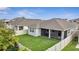 This aerial view shows the house and backyard with a white fence at 338 Wooded Vine Dr, Winter Springs, FL 32708