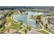 Beautiful aerial view of the neighborhood lake with walking paths, playground, picnic shelter, and parking at 338 Wooded Vine Dr, Winter Springs, FL 32708