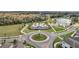 Aerial view of community pool, playground, and surrounding neighborhood at 338 Wooded Vine Dr, Winter Springs, FL 32708
