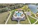 Beautiful aerial of the community pool, lake, playground, and walking paths at 338 Wooded Vine Dr, Winter Springs, FL 32708
