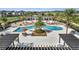 Stunning community pool featuring ample lounge seating, covered gazebos and lush tropical landscaping at 338 Wooded Vine Dr, Winter Springs, FL 32708