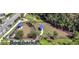 Aerial view of a fenced dog park with shelters providing residents space for pets to exercise and socialize at 338 Wooded Vine Dr, Winter Springs, FL 32708
