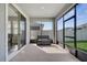 Screened lanai with sliding glass doors, offering a relaxing outdoor space with views of the backyard and plenty of natural light at 338 Wooded Vine Dr, Winter Springs, FL 32708