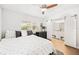 Bedroom with hardwood floors, neutral colors, and an en-suite bathroom at 3520 Sebring Ave, Orlando, FL 32806