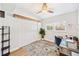 Bright bedroom featuring a ceiling fan, a large window, and a cozy rug, creating a comfortable and inviting space at 3520 Sebring Ave, Orlando, FL 32806