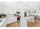 Bright, white kitchen with stainless steel appliances and modern track lighting at 3520 Sebring Ave, Orlando, FL 32806