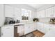 Well-lit kitchen featuring white cabinets, stainless steel appliances, and ample counter space at 3520 Sebring Ave, Orlando, FL 32806