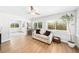 Bright sitting room with large windows, neutral tones, and hardwood floors at 3520 Sebring Ave, Orlando, FL 32806