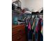 Organized walk-in closet with shelves, drawers, and hanging rods for ample storage at 3582 Forster Ave, Leesburg, FL 34748