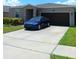 Charming single-Gathering home with a well-maintained lawn, two-car garage, and long driveway at 3582 Forster Ave, Leesburg, FL 34748