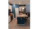 Modern kitchen with stainless steel appliances, granite countertops, and a spacious center island at 3582 Forster Ave, Leesburg, FL 34748