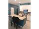 Bright kitchen featuring granite countertops, an island with bar stool seating, and stainless steel appliances at 3582 Forster Ave, Leesburg, FL 34748
