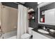 Cozy bathroom featuring a shower-tub combo and dark gray walls at 4027 Lakeside Reserve Ct, Orlando, FL 32810