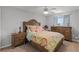Comfortable bedroom with a colorful bed, a ceiling fan, and natural light at 4027 Lakeside Reserve Ct, Orlando, FL 32810