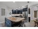 Kitchen with island, stainless steel appliances, dark wood cabinets and barstool seating at 4027 Lakeside Reserve Ct, Orlando, FL 32810