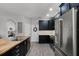 Kitchen with island, stainless steel appliances, and dark wood cabinets at 4027 Lakeside Reserve Ct, Orlando, FL 32810