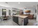 Open concept kitchen and living area with stainless steel appliances at 4027 Lakeside Reserve Ct, Orlando, FL 32810