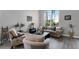 Living room with an arched window, comfortable seating, and stylish decor at 4027 Lakeside Reserve Ct, Orlando, FL 32810