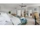 Spacious main bedroom with lots of doors and a comfortable bed at 4027 Lakeside Reserve Ct, Orlando, FL 32810