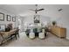 Bright main bedroom with ceiling fan, a desk, and natural light streaming through the windows at 4027 Lakeside Reserve Ct, Orlando, FL 32810