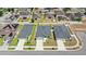 Home aerial view highlights the backyard putting green and neighborhood setting at 4215 Swan St, Haines City, FL 33844