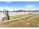 Backyard features a golf practice area with putting green and net at 4215 Swan St, Haines City, FL 33844