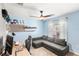 Bedroom featuring modern desk and gray sectional sofa at 4215 Swan St, Haines City, FL 33844