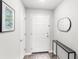 Welcoming foyer featuring a white door, elegant mirror, eye-catching artwork, and stylish flooring at 4215 Swan St, Haines City, FL 33844