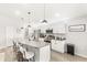 Bright kitchen features granite countertops, stainless steel appliances and pendant lighting at 4215 Swan St, Haines City, FL 33844