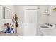 Laundry room features a modern washer and dryer, folding table, and wire shelf at 4215 Swan St, Haines City, FL 33844