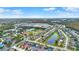 An aerial view shows a well-maintained community, lakes, local amenities, and lush trees at 4347 Creekside Blvd, Kissimmee, FL 34746