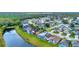 Aerial shot of property with screened-in pool, close to a pond and forest in a quiet neighborhood at 4347 Creekside Blvd, Kissimmee, FL 34746