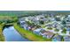 Aerial view of this home's backyard pool, with a lake and beautiful tree coverage at 4347 Creekside Blvd, Kissimmee, FL 34746