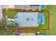 Aerial view shows the home's layout with screened-in pool, patio, lawn, and a 2-car garage at 4347 Creekside Blvd, Kissimmee, FL 34746