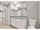Bathroom featuring a modern vanity with granite countertop and a large mirror at 4347 Creekside Blvd, Kissimmee, FL 34746