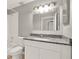 Bathroom featuring a vanity with granite countertop and a bathtub at 4347 Creekside Blvd, Kissimmee, FL 34746