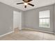 Bedroom featuring a ceiling fan, closet, and tile flooring at 4347 Creekside Blvd, Kissimmee, FL 34746