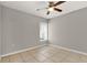 Bedroom with tile flooring, ceiling fan, and natural light from a window at 4347 Creekside Blvd, Kissimmee, FL 34746
