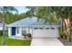 Charming single-Gathering home with a 2-car garage, well-maintained landscaping, and a welcoming entrance at 4347 Creekside Blvd, Kissimmee, FL 34746