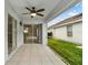 Covered patio featuring sliding glass doors and ceiling fan at 4347 Creekside Blvd, Kissimmee, FL 34746